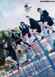 A group of young women in school uniforms on a playground.