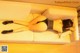 A woman laying on a couch with her legs crossed.